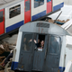 Simulated casualties look out from a Tube train carriage.